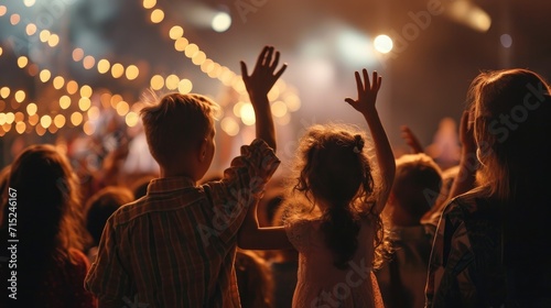 Christian family raised hands to praise God in church worship concert concept for religion, worship, prayer heaven after life photo