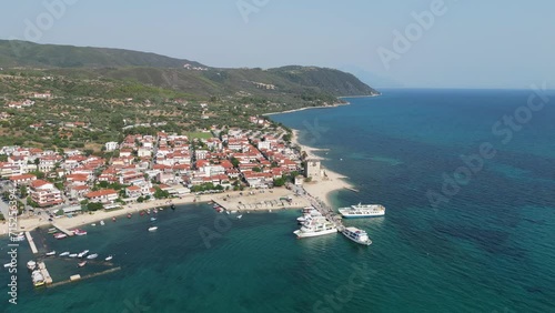 Ferry Boats at Port in Ouranoupoli, Athos, Halkidiki, Greece - Aerial 4k Circling photo