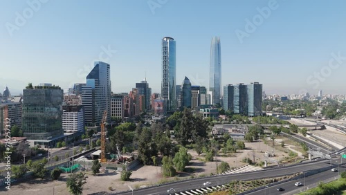 Aerial View Of Gran Torre Santiago, La Portada And Titanium Park Buildings On Sunny Day With Blue Skies. Dolly Forward Shot photo