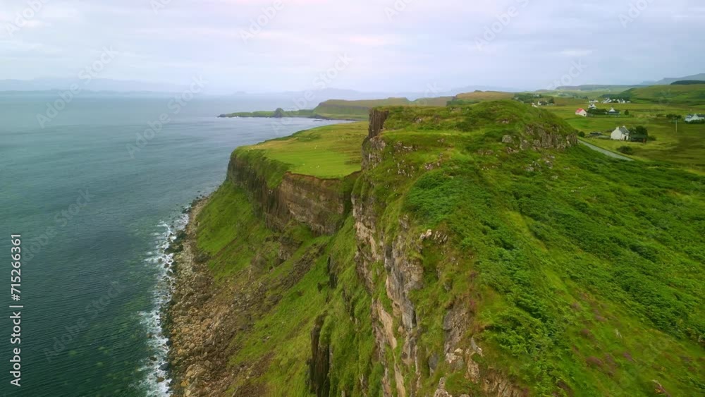 Aerial view drone Isle of Skye in Scotland. Coastal sea cliffs. Scottish travel destination, tourism landmark in UK. Aerial view drone Isle of Skye in Scotland. Coastal sea cliffs. Scottish travel destination, tourism landmark in UK.