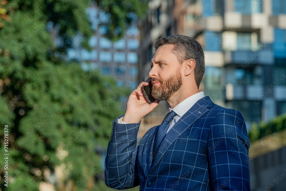 businessman has smartphone call outdoor, copy space. businessman having smartphone call businessman has smartphone call outdoor, copy space. businessman having smartphone call