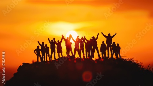 A powerful silhouette of a group of teens raising their hands in unity  Ai Generated.