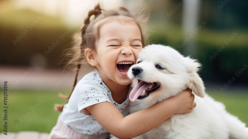 Small girl laughing while playing with her puppy outside Small girl laughing while playing with her puppy outside