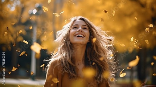 A young woman celebrates just being alive in the autmn fall