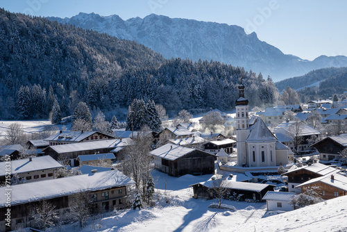 The mountaineering village of Sachrang in Chiemgau, Bavaria, Germany with a view of the Zahmer Kaiser in Tyrol, Austria in winter