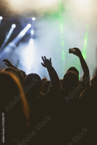 Abstract photo of crowd at concert and blurred stage lights.