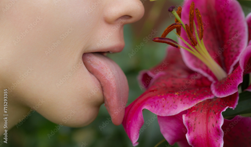 Tongue sensual lick orchid. Sexy woman mouth with tongue sticking out. Beautiful mouth close-up. Big female tongue. Sexy tongue. Tongue sensual lick orchid. Sexy woman mouth with tongue sticking out. Beautiful mouth close-up. Big female tongue. Sexy tongue.
