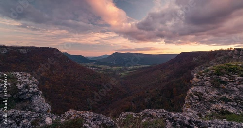 Balcon de Pilatos viewpoint Ubaba in Navarra, Urbasa timelapse during sunset in fall autumn season Large deep valley viewed from a cliff with beautiful clouds photo