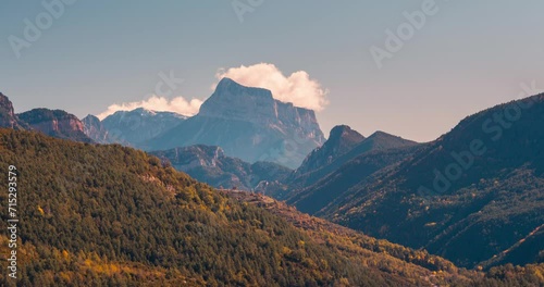 Pena montanesa mountain peak Timelapse blue sky morning and cloud in mountain valley during fall autumn season beautiful landscape photo