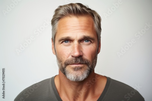 Portrait of a handsome middle-aged man with grey beard.