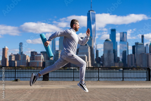 Sportsman jogger running or jogging. Man in sports suit training jogging. Running man in Manhattan. Morning sport workout jogger run in New York. The jogger run at sport training. Physical fitness © be free