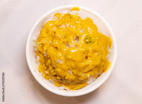 top view bowl of rice with curry on top at horizontal composition