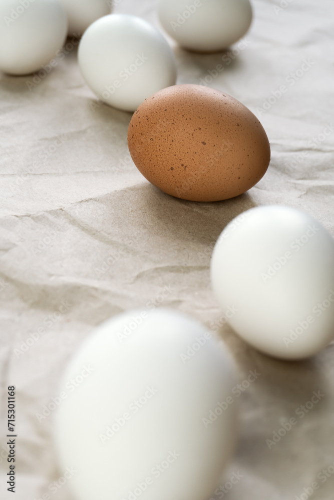 White and brown eggs on the table White and brown eggs on the table
