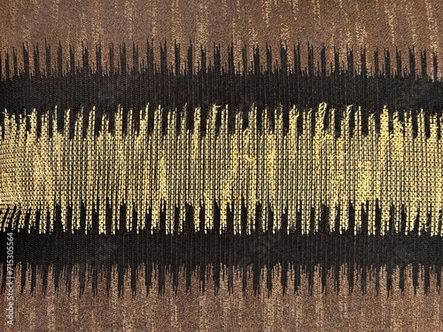 Random ethnic looking seamless fabric in Brown, black, and yellow texture.