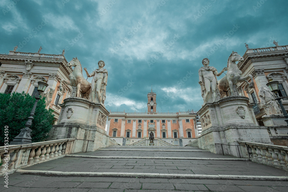 Cordonata capitolina, a stone walkway to the capitol hill in Rome, access to the Senatorial palace on the top. Cloudy day with dramatic skies.