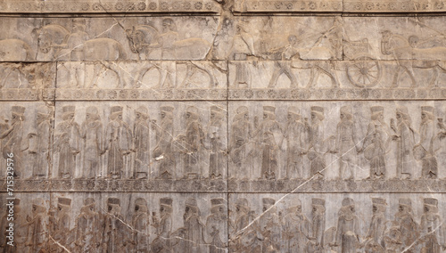 Принти на полотні Ancient wall with bas-relief with assyrian warriors with spears,  horses, chario