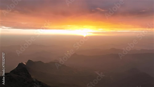 Aerial View of Foggy and Colorful mountains on sunset. photo