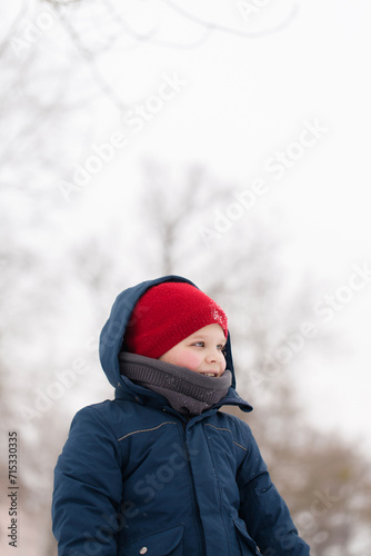 Portrait of a cheerful boy in winter