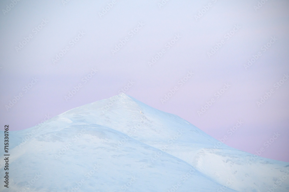 Fotografie Frozen mountain under blue sky in highlands