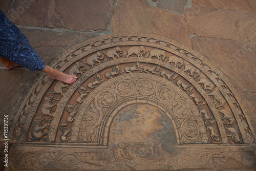 Stone threshold with ornaments before the entrance to the The te photo