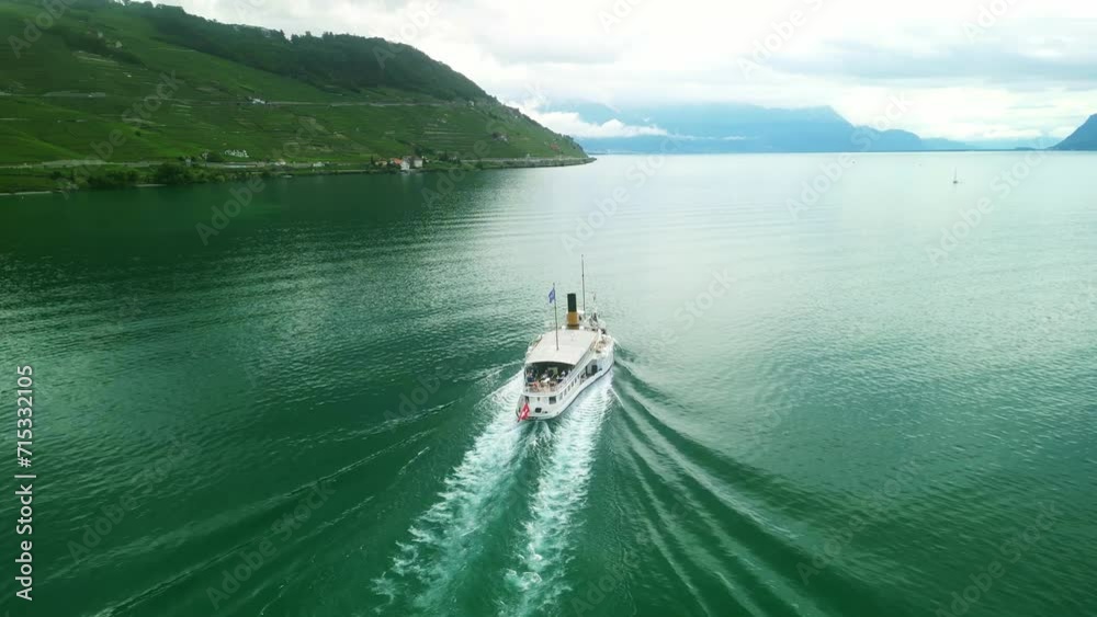 Drone Switzerland 4k. La Suisse steamboat ship on Lake Geneva. Swiss Flag. Geneva to Lausanne tour, Lac Leman, Switzerland summer tourism destination. Turquoise blue water.