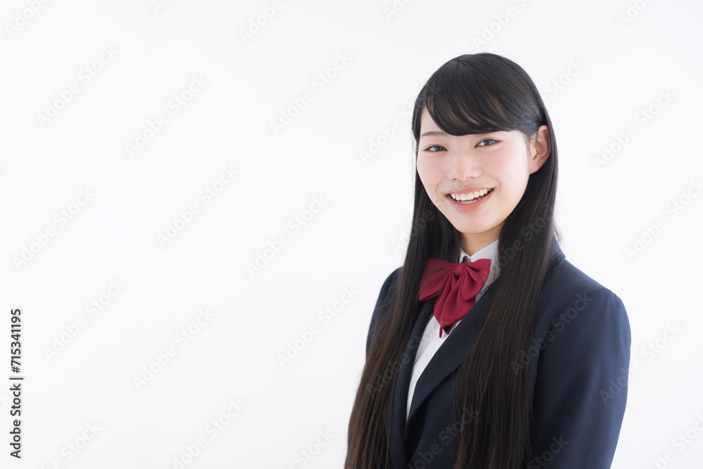 High school girl smiling in front of the camera on an easy-to-use white background Upper body close-up for images such as college entrance exams High school girl smiling in front of the camera on an easy-to-use white background Upper body close-up for images such as college entrance exams