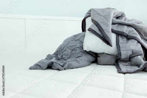 Close up image of bed with bed clothes and pillows. Housekeeping concept © Nadezhda
