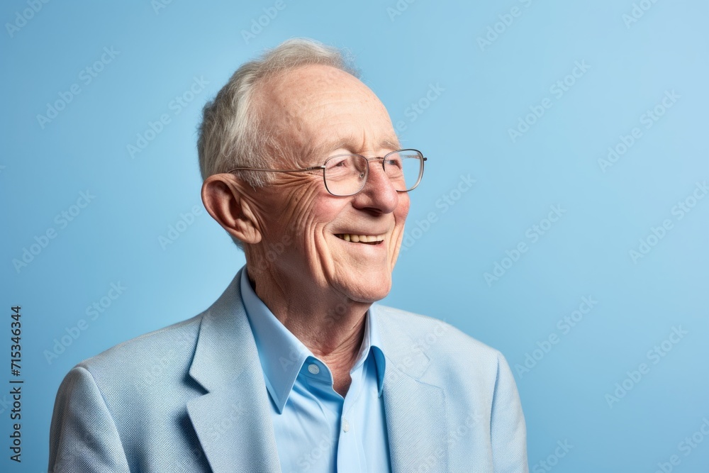 Portrait of a happy senior man with glasses on a blue background Portrait of a happy senior man with glasses on a blue background