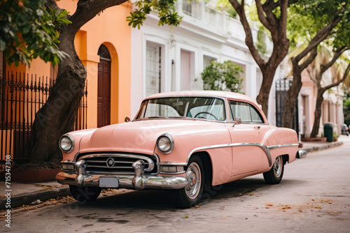 Vintage car in a striking, uniform peach fuzz color parked on a quiet street