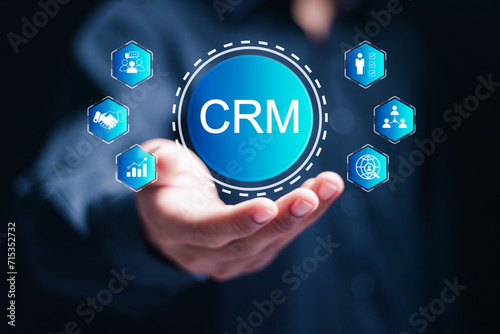 CRM Customer Relationship Management concept. businessman hold virtual customer network management and development of customer information exchange, social media, digital online.