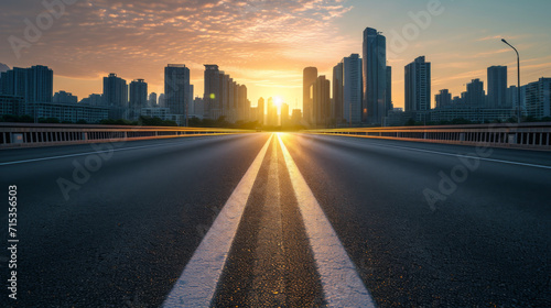Empty highway in the middle of city at sunset photo