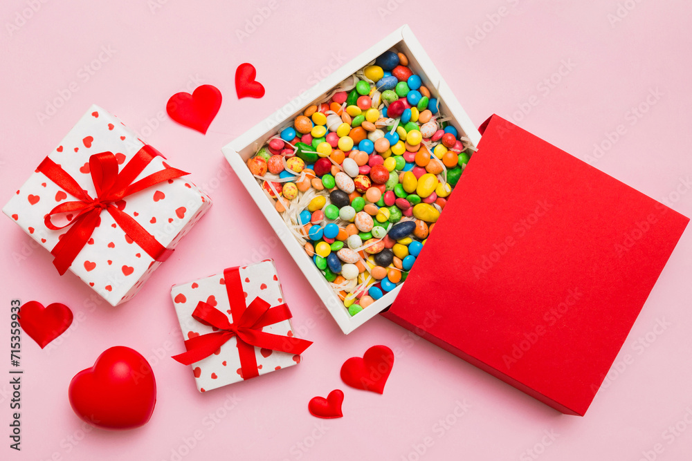 Valentine day composition: sweet candy, with gift boxes with bow and red felt hearts, photo template, background. Top View with copy space Valentine day composition: sweet candy, with gift boxes with bow and red felt hearts, photo template, background. Top View with copy space