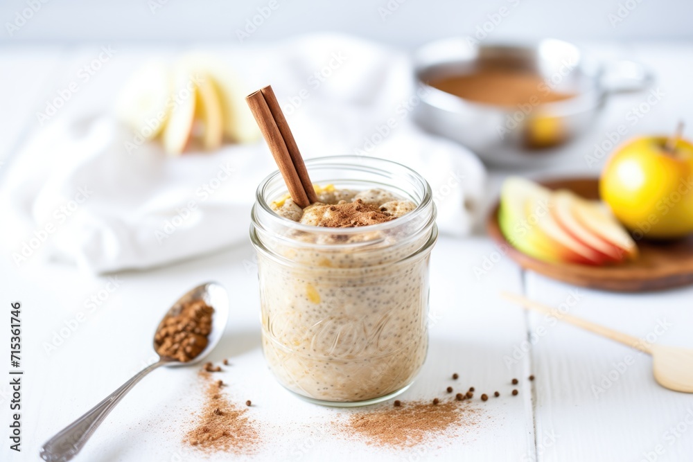 cinnamon apple chia pudding in a mason jar with a spoon cinnamon apple chia pudding in a mason jar with a spoon
