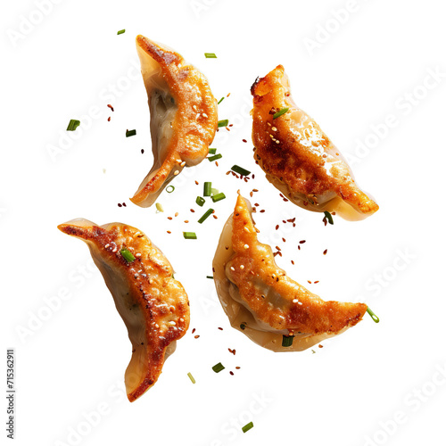 Fried Gyoza dumplings flying falling isolated on white transparent background, top view, ultra realistic, PNG photo