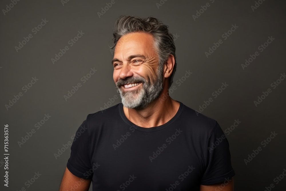 Portrait of a smiling middle-aged man in a black t-shirt. Portrait of a smiling middle-aged man in a black t-shirt.