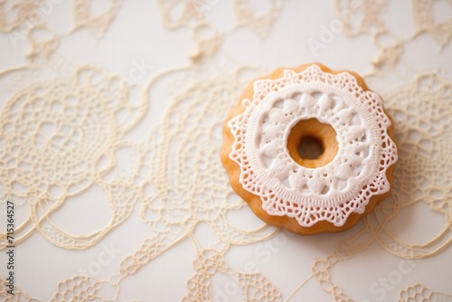 sugar glazed donut on a lace doily