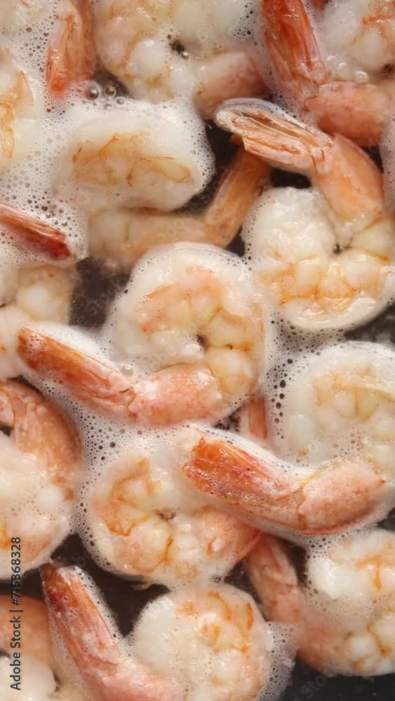 Boiled white shrimp in boiling water in a pan Boiled white shrimp in boiling water in a pan