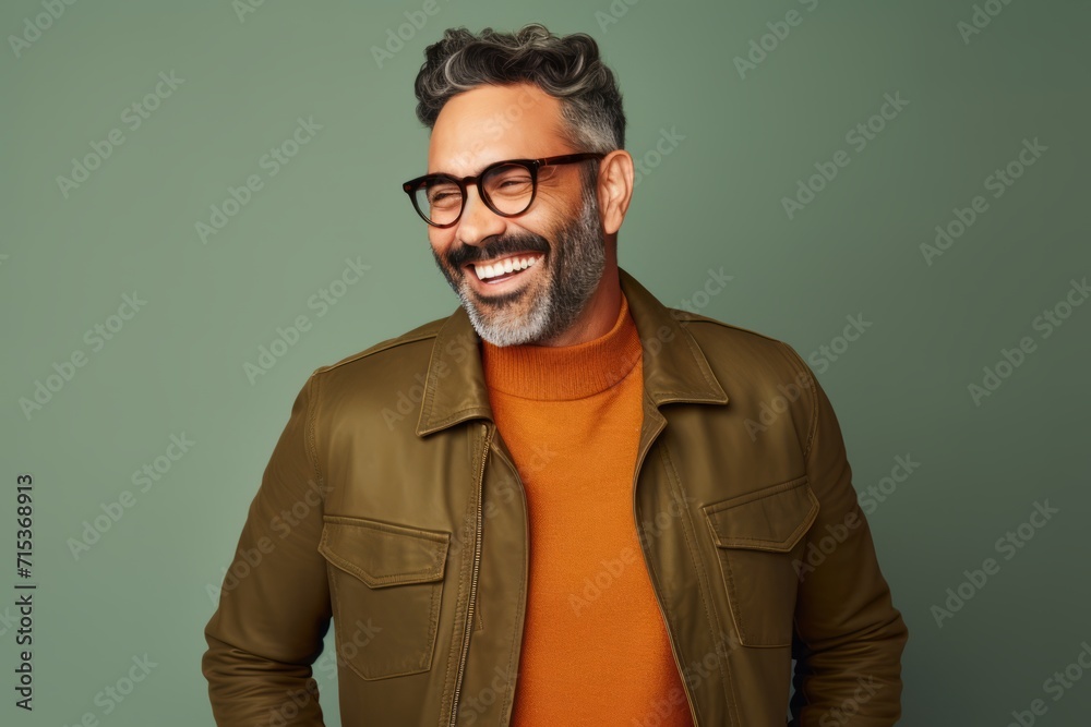 Handsome middle-aged man in stylish casual clothes and glasses. Handsome middle-aged man in stylish casual clothes and glasses.