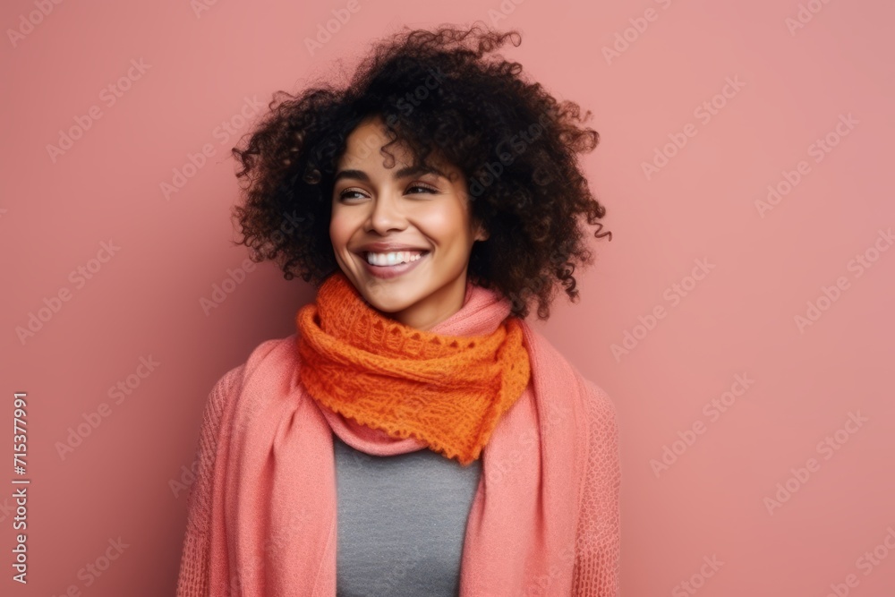 Portrait of a smiling african american woman in scarf and sweater Portrait of a smiling african american woman in scarf and sweater