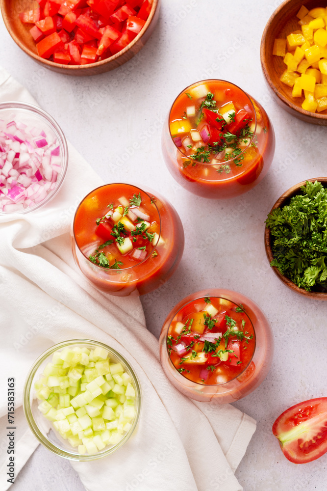 Spanish tomato gazpacho cold soup styled and decorated in glasses
