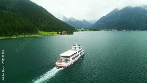 Tour boat on Achen Lake Achensee in Austrian Alps. Pertisau village popular tourist sightseeing destination in Tyrol region. Drone aerial view  photo