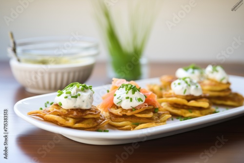 savory potato waffles with a side of sour cream and chives