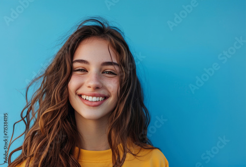 Close-up portrait of her she nice attractive lovely pretty charming cheerful cheery curious curly haired girl creating new strategy isolated over blue color background.