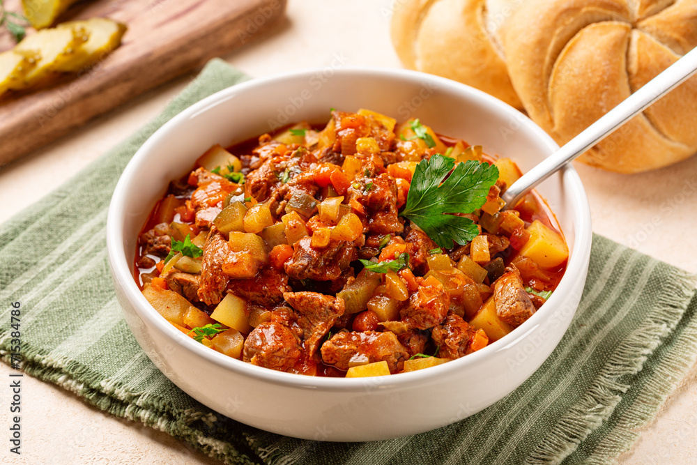 Azu dish, traditional Tatar meat stew made from beef with potatoes , tomato sauce and pickles. Azu dish, traditional Tatar meat stew made from beef with potatoes , tomato sauce and pickles.