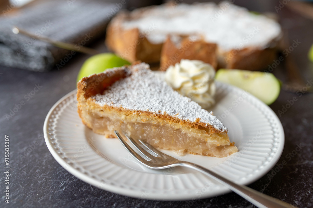 Irish apple pie with whipped cream on a plate