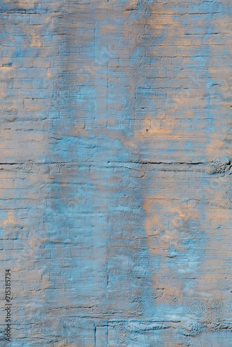 Grunge wall, stucco rough surface. Cyan and beige, vertical. Background or texture for design