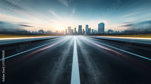 Moving forward at high speed blurred and empty road with cityscape background.  © imlane