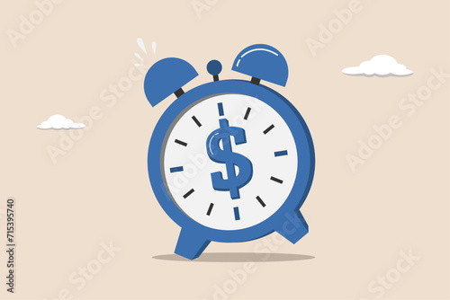 Time for money, deadline to start building wealth concept, making profit from investment, ringing alarm clock with dollar money sign on clock face.