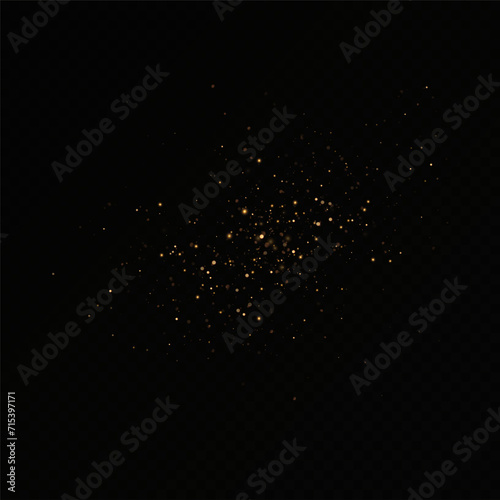 Golden sequins glow with many lights. Glittering dust. Luxurious background of golden particles.