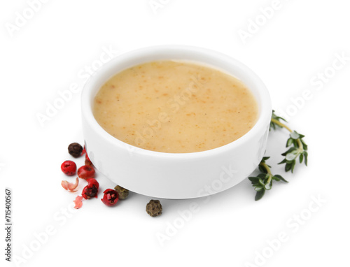 Delicious turkey gravy  thyme and peppercorns isolated on white